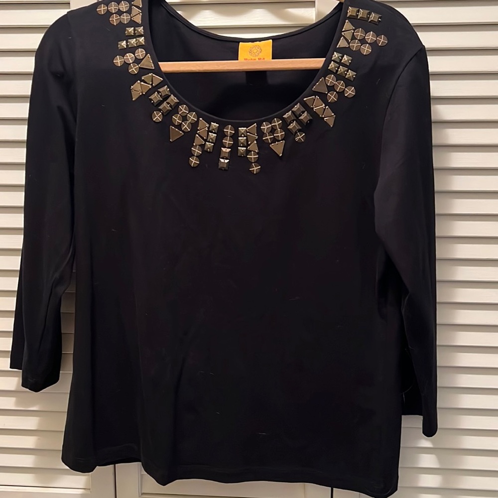 Black shirt with tarnished gold color metal neck decor. Size Med. Ruby Rd.